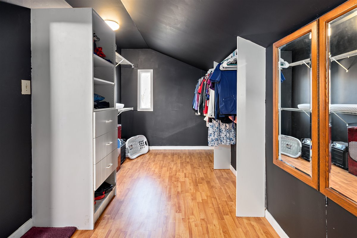 2293 Jericho Road Aurora, IL 60506 - Photo 22 of 26 a bedroom with a bed and a walk in closet