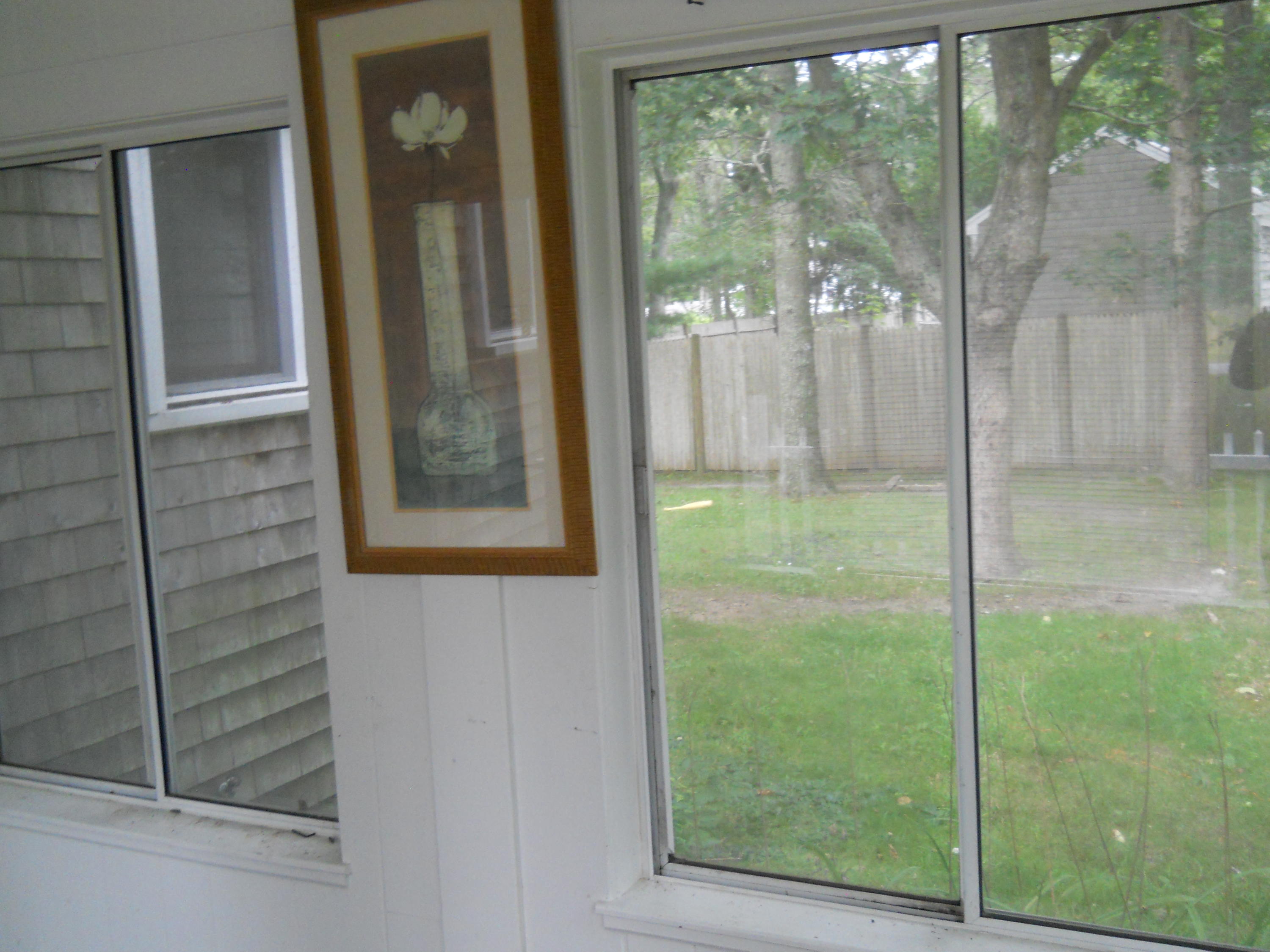 30 Dunns Pond Road Hyannis, MA 02601 - Photo 13 of 30 a view of a glass door of the house from a room
