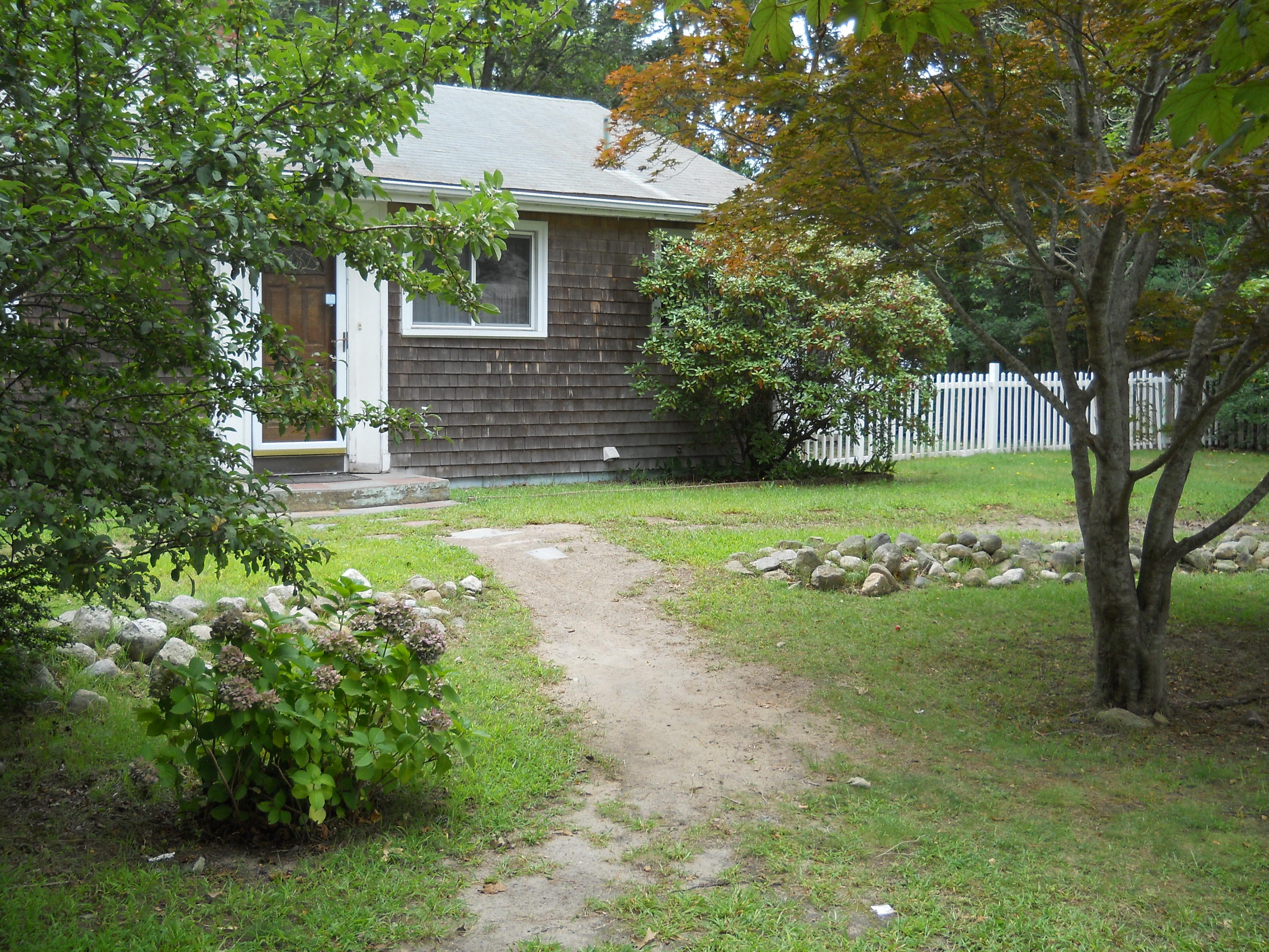 30 Dunns Pond Road Hyannis, MA 02601 - Photo 2 of 30 a view of a house with a yard and a garden