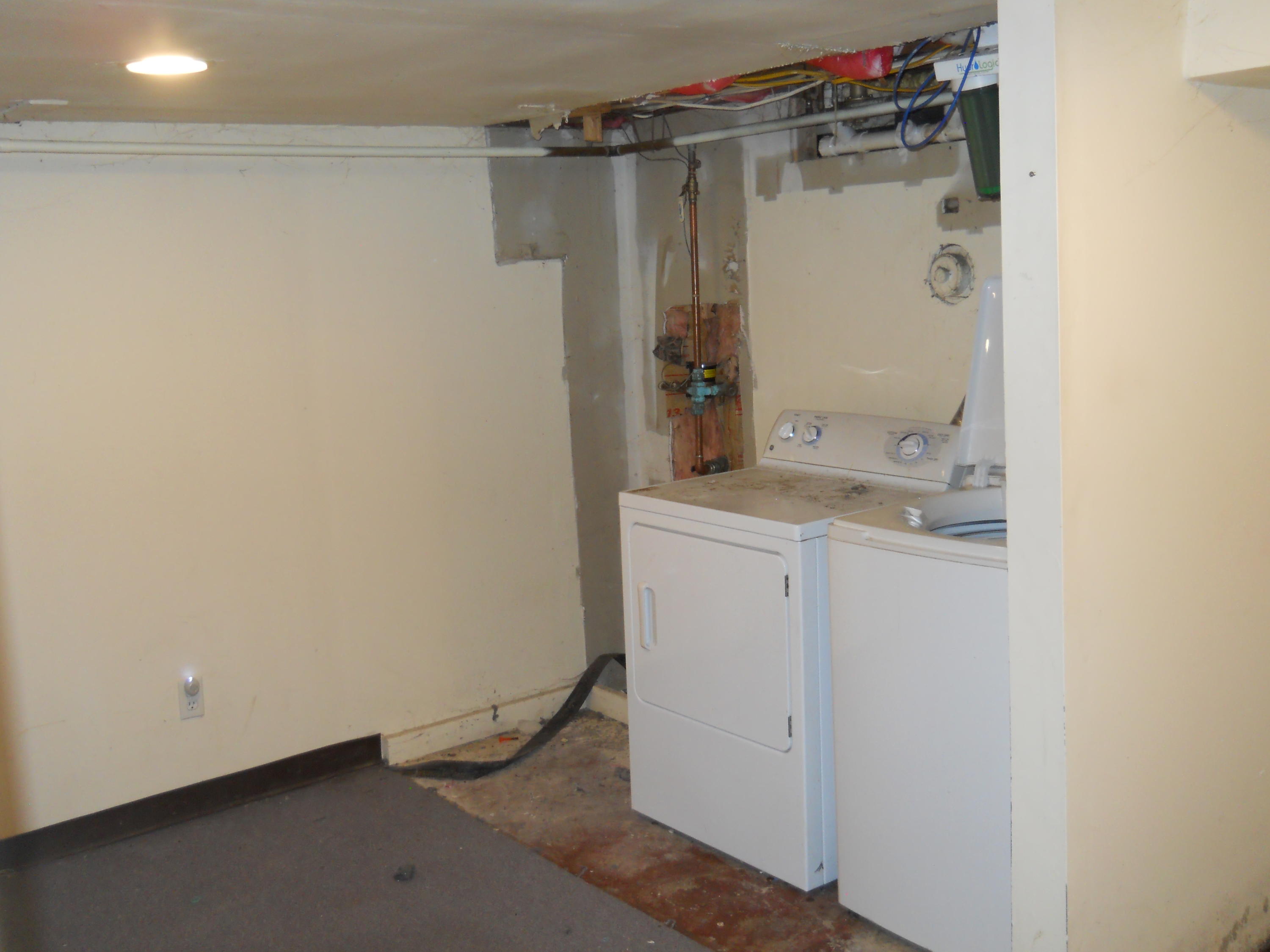 30 Dunns Pond Road Hyannis, MA 02601 - Photo 25 of 30 a bathroom with a granite countertop sink and white cabinets