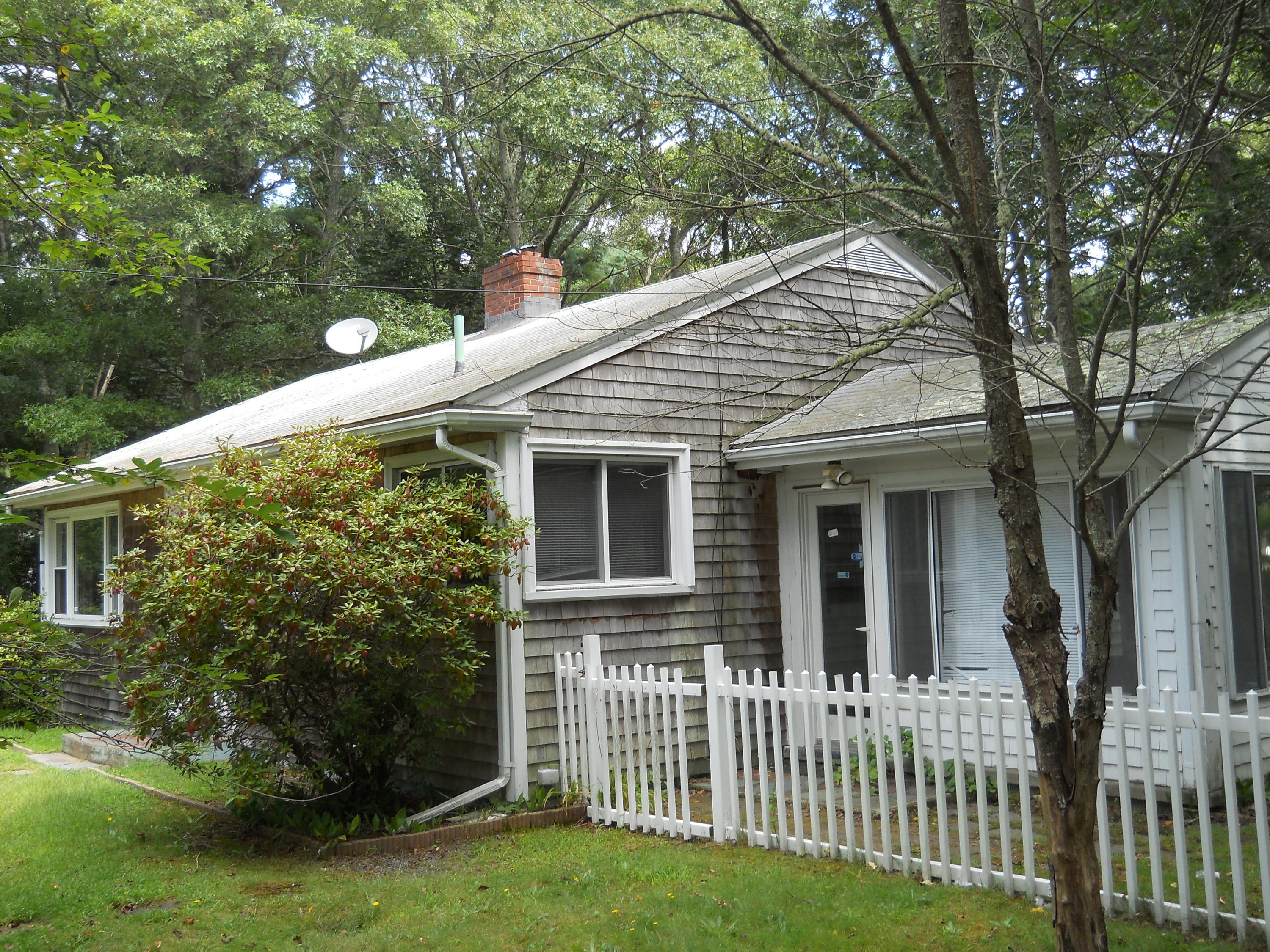 30 Dunns Pond Road Hyannis, MA 02601 - Photo 5 of 30 a front view of a house with a garden
