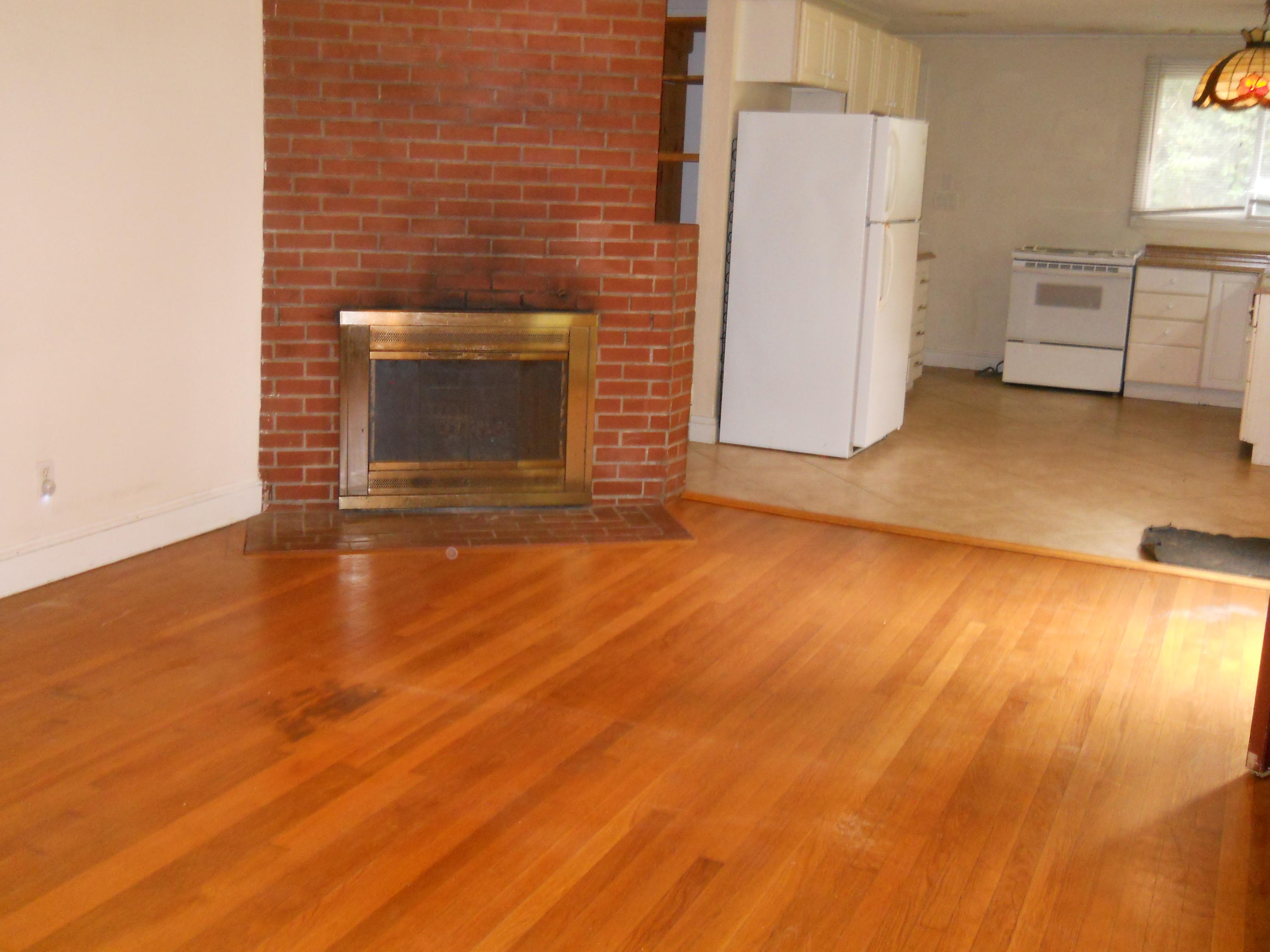 30 Dunns Pond Road Hyannis, MA 02601 - Photo 8 of 30 a view of empty room with a fireplace and wooden floor