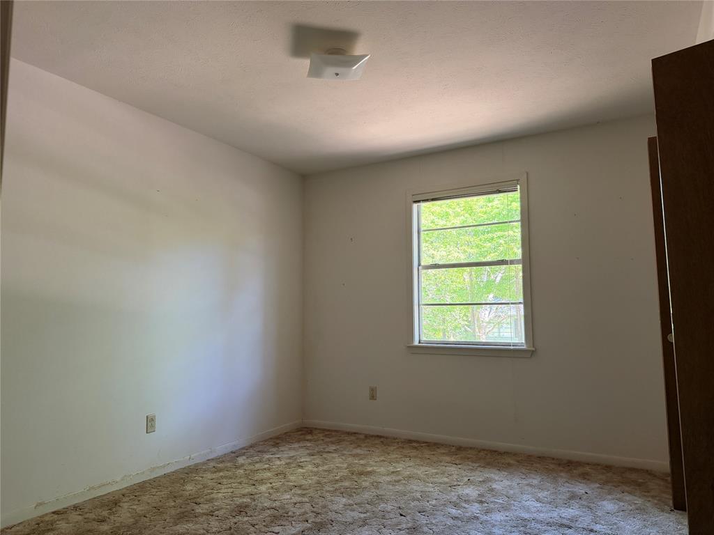 336 Butler Street Rusk, TX 75785 - Photo 16 of 27 an empty room with a window