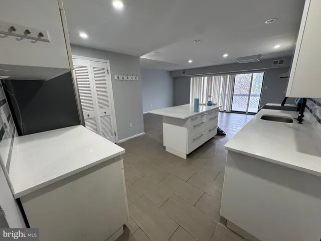 a bathroom with a toilet a sink and a mirror