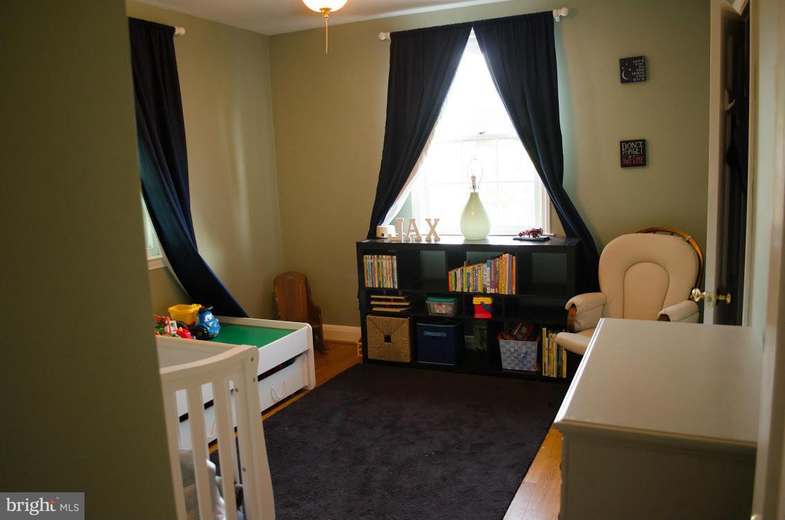 514 Windwood Road Baltimore, MD 21212 - Photo 15 of 18 a living room with baby crib furniture and a window