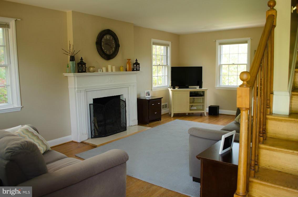 514 Windwood Road Baltimore, MD 21212 - Photo 3 of 18 a living room with furniture and a fireplace