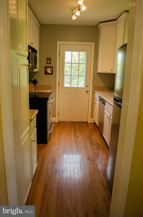 514 Windwood Road Baltimore, MD 21212 - Photo 7 of 18 a view of a kitchen from a hallway