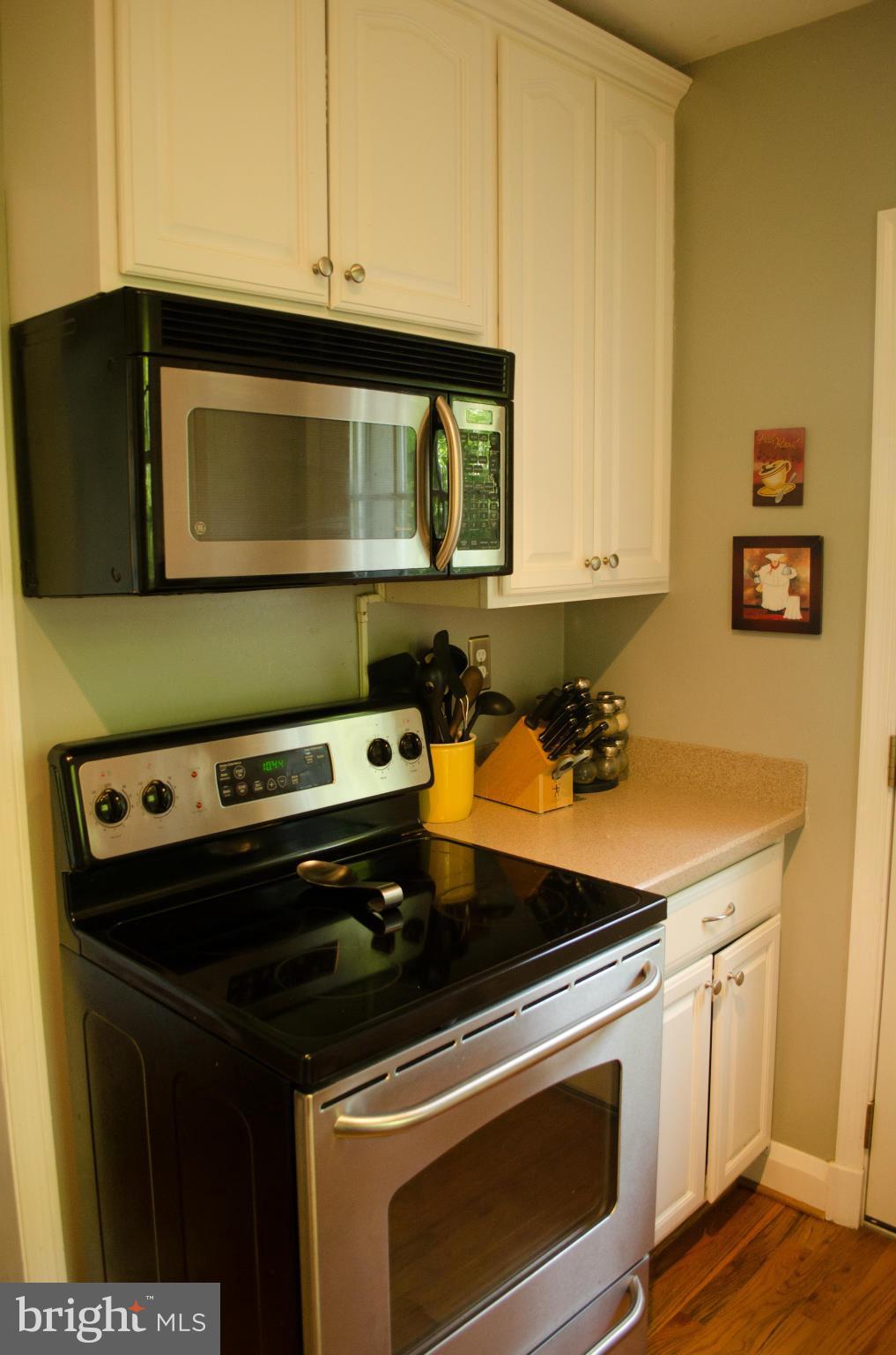 514 Windwood Road Baltimore, MD 21212 - Photo 10 of 18 a kitchen with a stove and a microwave