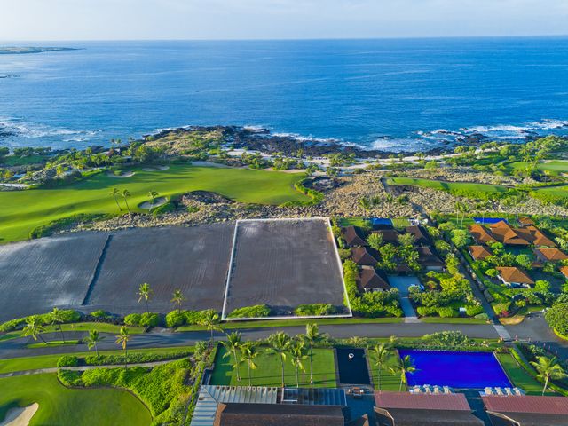 an aerial view of a house with a garden