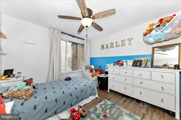 a bed room with a bed and a window