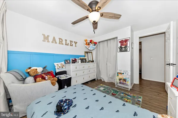 a bedroom with furniture and a chandelier