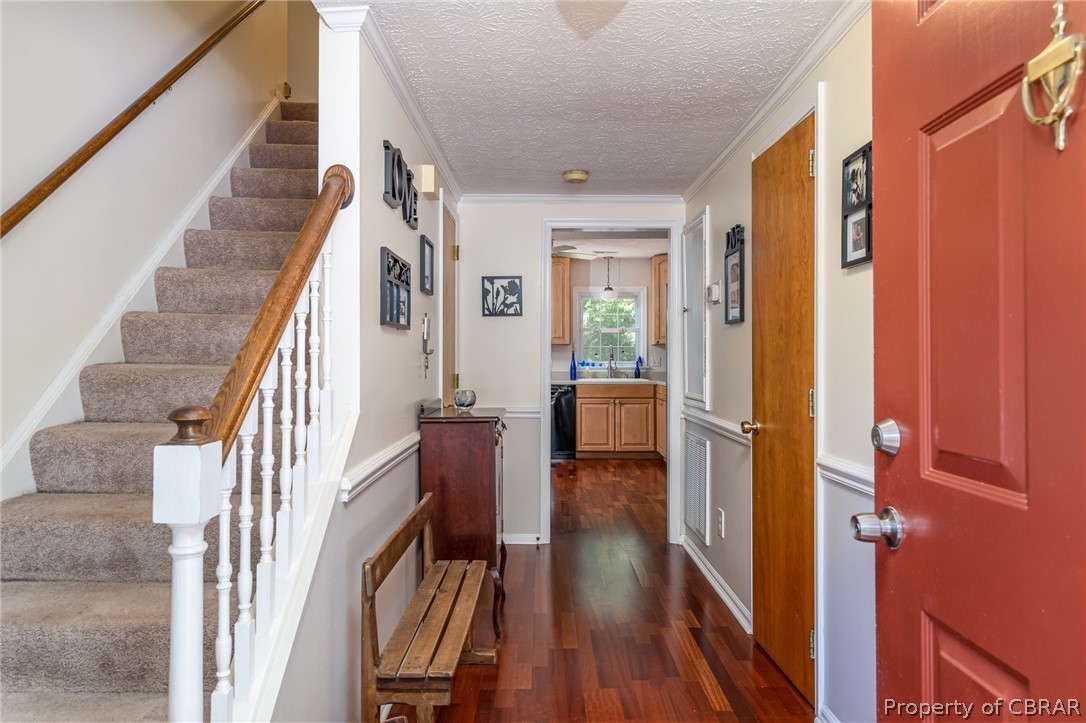 7668 Forbes Road Gloucester, VA 23061 - Photo 12 of 34 Beautiful, durable laminate flooring leads into the kitchen