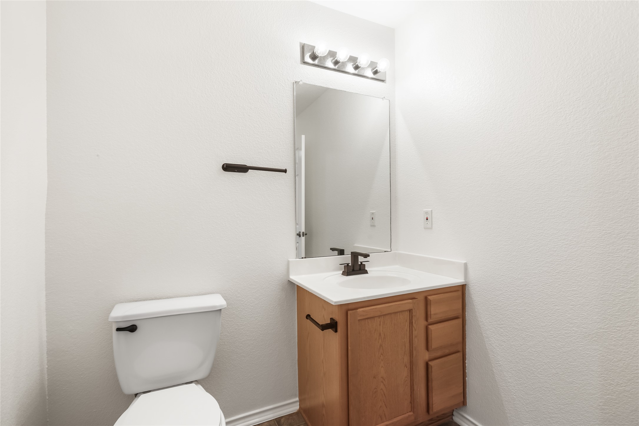 2010 Ashberry Trail Georgetown, TX 78626 - Photo 8 of 24 Bathroom featuring vanity and a textured wall