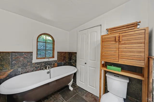 a bathroom with a bathtub and a sink