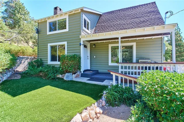 front view of a house with a yard