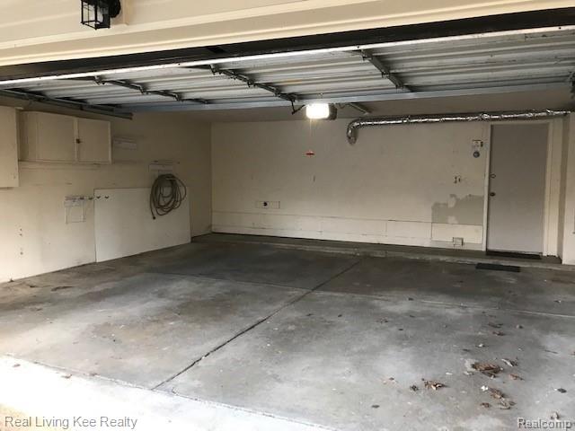 1403 Paddle Wheel Lane Rochester, MI 48306 - Photo 49 of 54 Spacious garage plenty of space for bikes, extra fridge etc. very rare to find in condo units in Rochester.