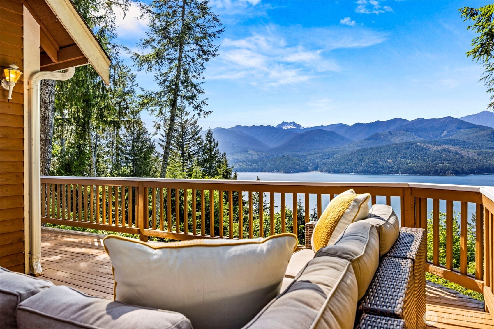 19736 Northwest Stavis Bay Road Seabeck, WA 98380 - Photo 15 of 39 a roof deck with couches and wooden floor