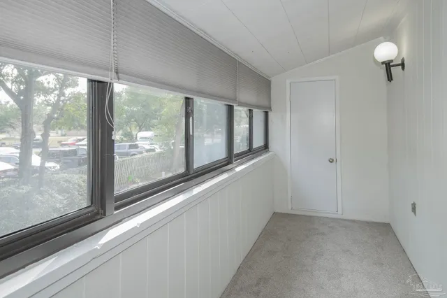 a view of a room with windows