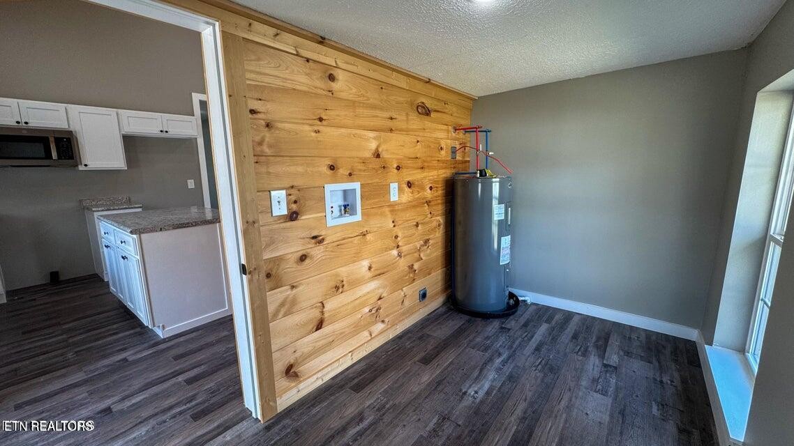 138 Lloyd Street Oneida, TN 37841 - Photo 17 of 36 an empty room with wooden floor and cabinet