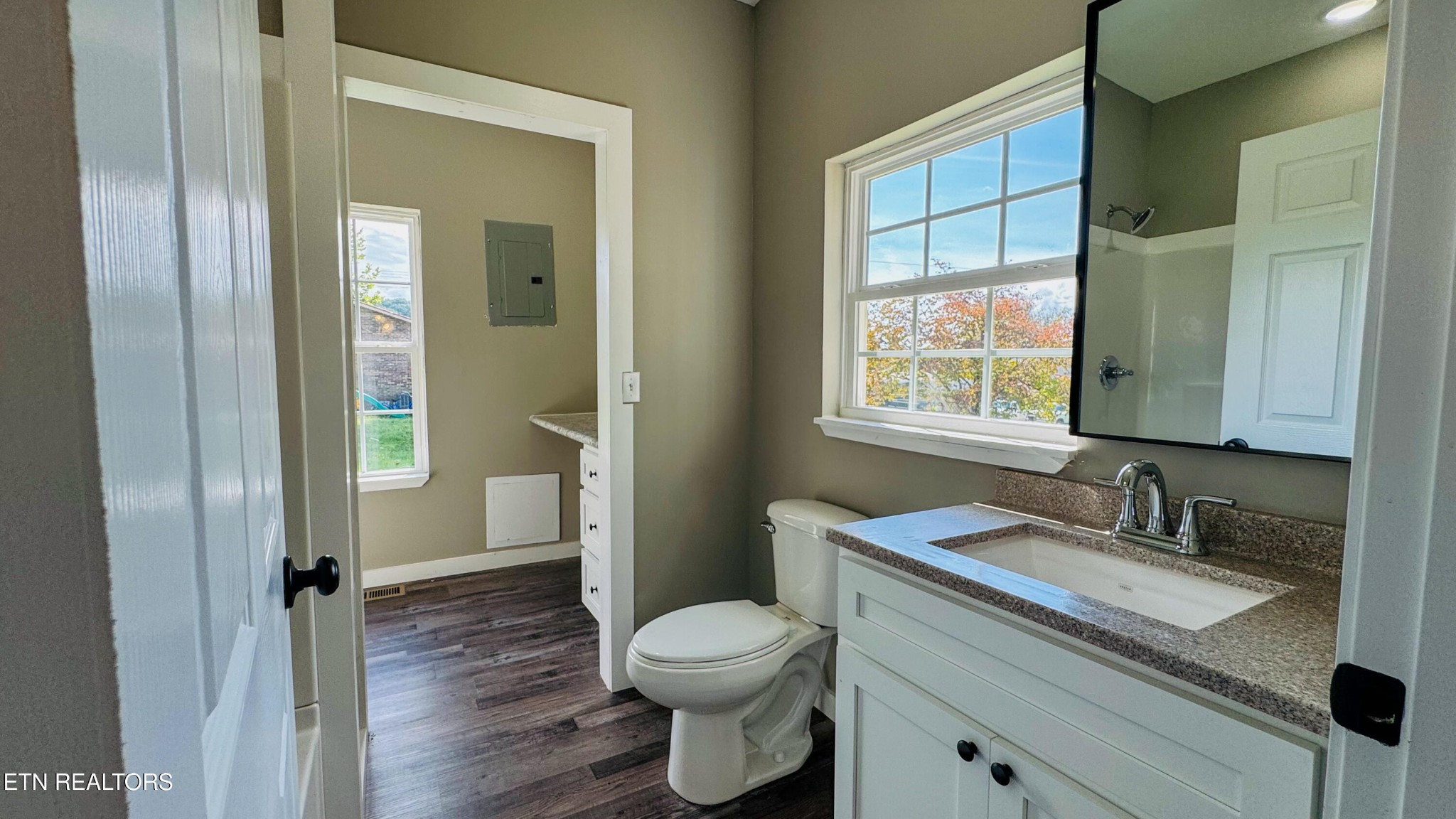 138 Lloyd Street Oneida, TN 37841 - Photo 21 of 36 a bathroom with a granite countertop sink toilet and shower