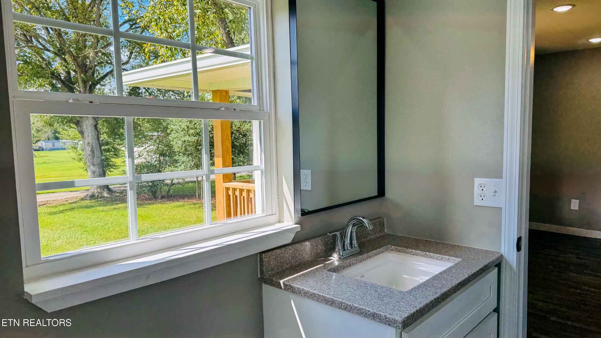 138 Lloyd Street Oneida, TN 37841 - Photo 22 of 36 a bathroom with a sink and a mirror