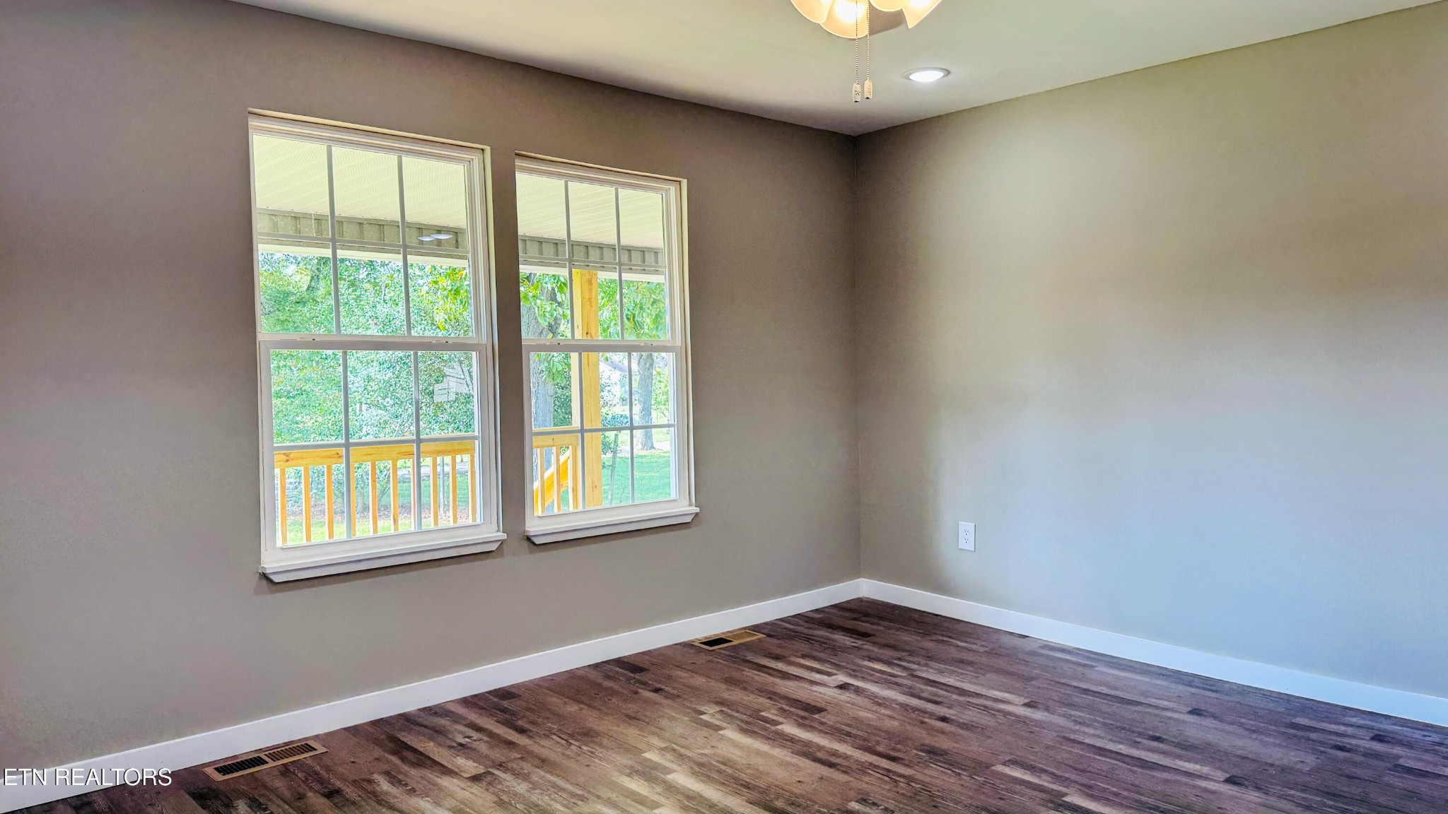 138 Lloyd Street Oneida, TN 37841 - Photo 29 of 36 a view of an empty room with wooden floor and a window