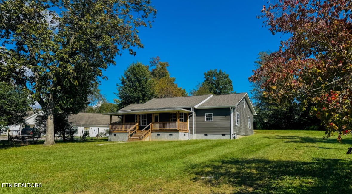 138 Lloyd Street Oneida, TN 37841 - Photo 3 of 36 a front view of a house with a yard
