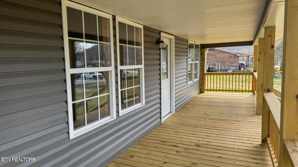 138 Lloyd Street Oneida, TN 37841 - Photo 9 of 36 a view of balcony with wooden floor