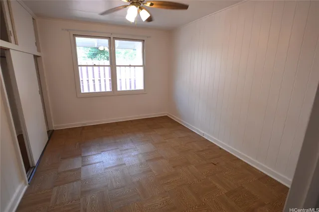 an empty room with windows and entrance