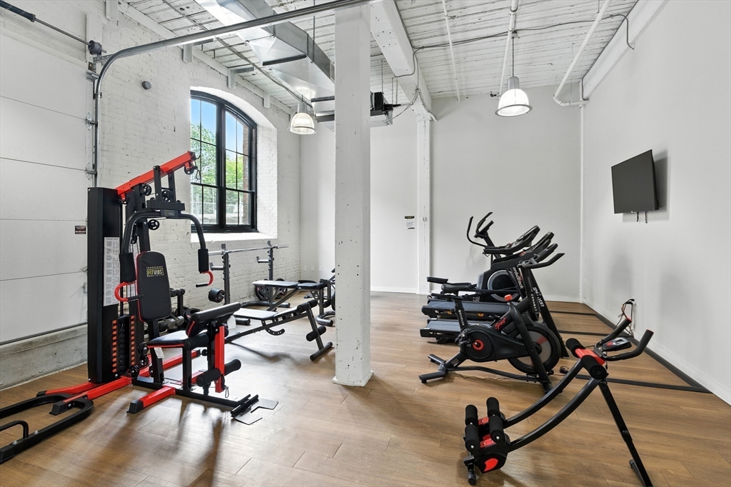 55 Sterling Street, Unit 305 Clinton, MA 01510 - Photo 19 of 31 a view of a room with gym equipment