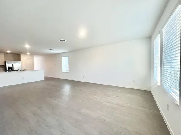 an empty room with a empty space and a window