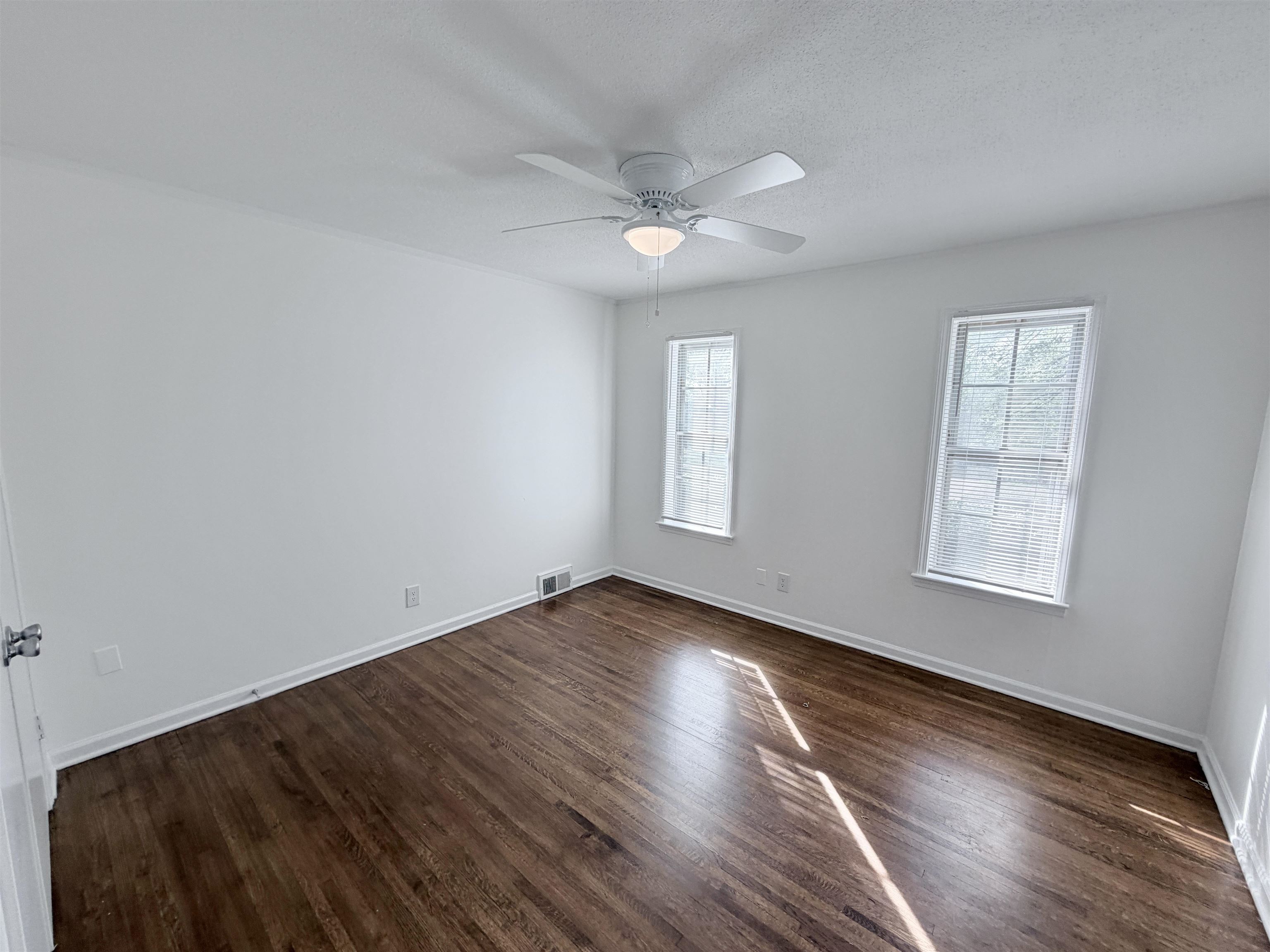 3118 Estes Street Memphis, TN 38115 - Photo 11 of 32 wooden floor in an empty room with a window