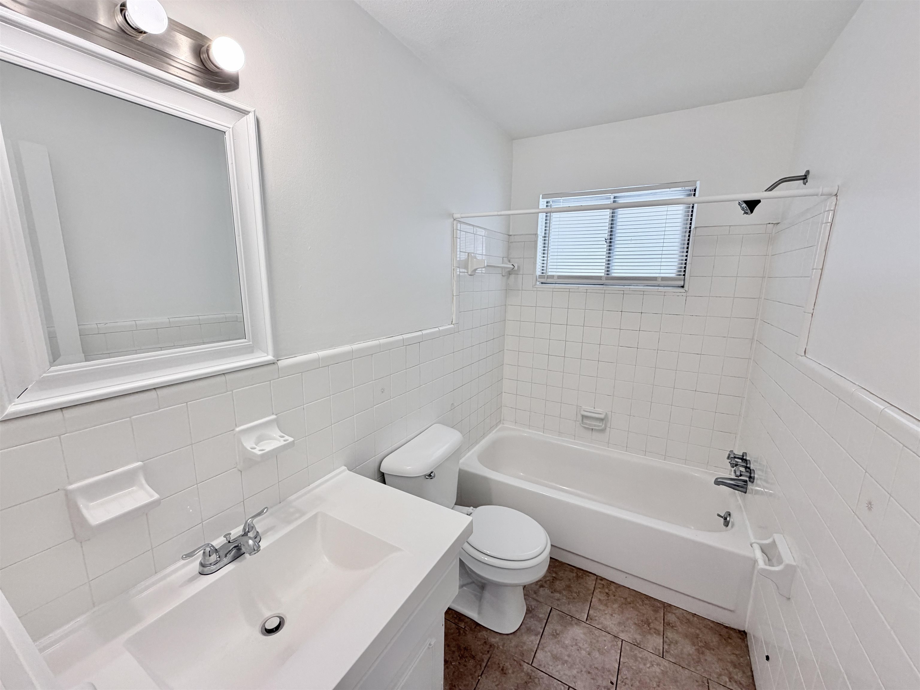 3118 Estes Street Memphis, TN 38115 - Photo 12 of 32 a bathroom with a sink a toilet and shower