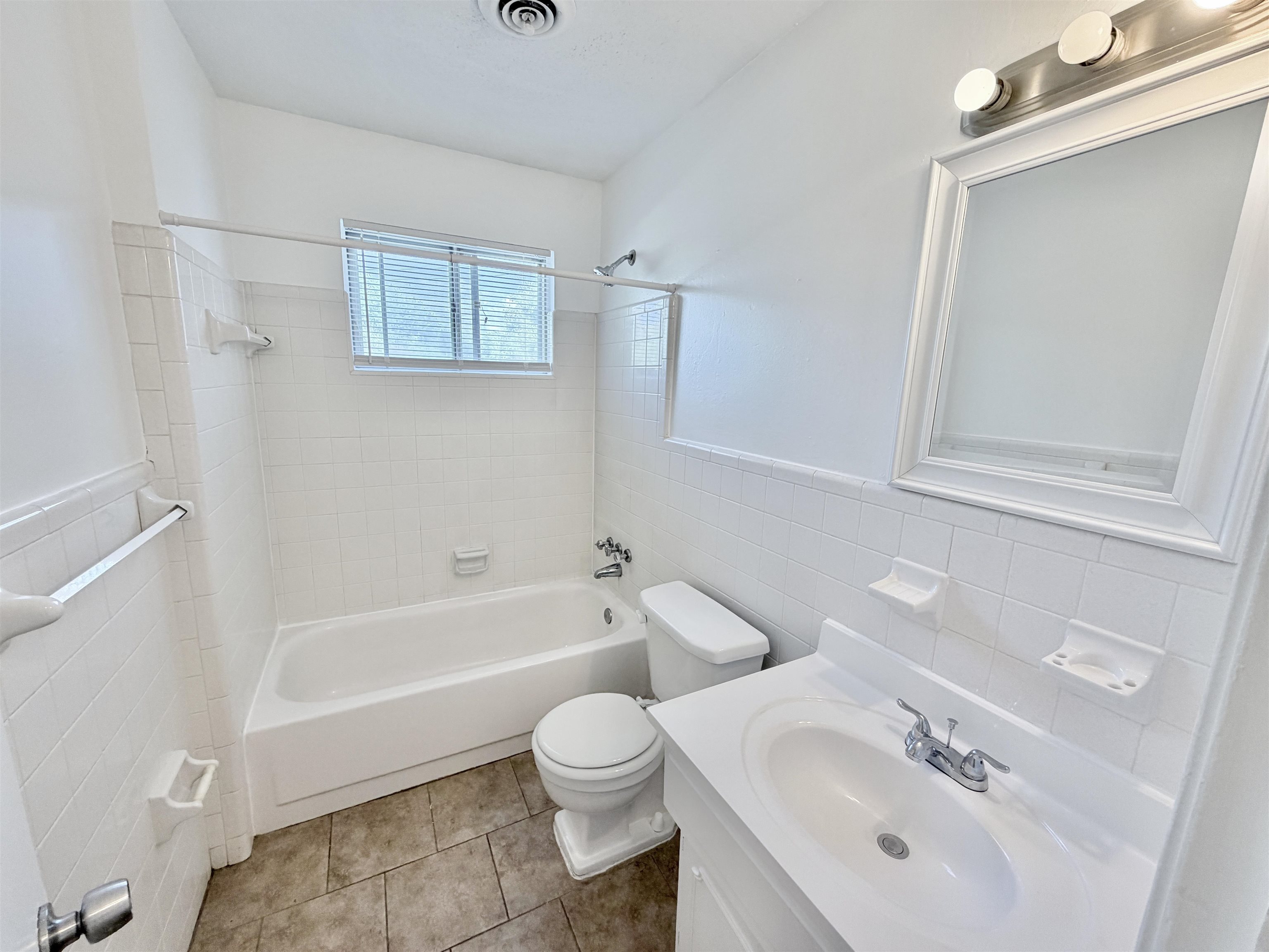 3118 Estes Street Memphis, TN 38115 - Photo 20 of 32 a bathroom with a sink toilet and shower