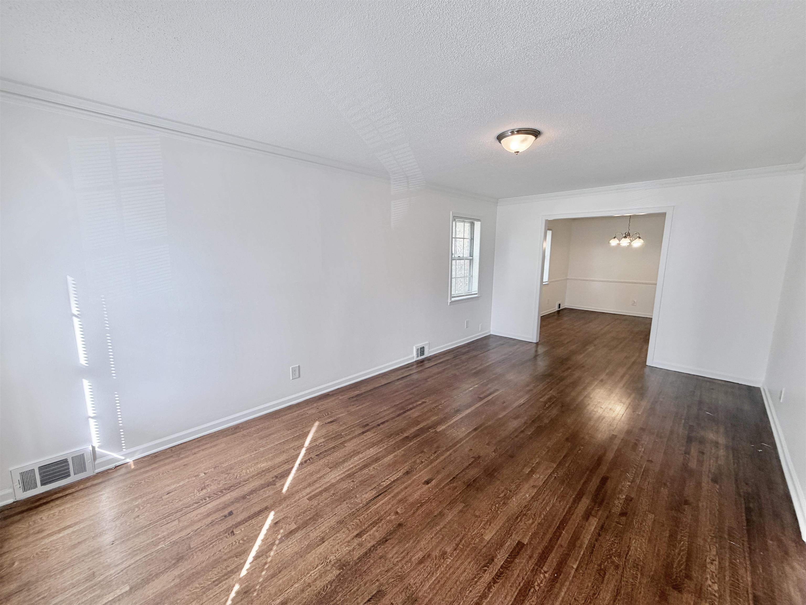 3118 Estes Street Memphis, TN 38115 - Photo 23 of 32 a view of wooden floor and windows in a room