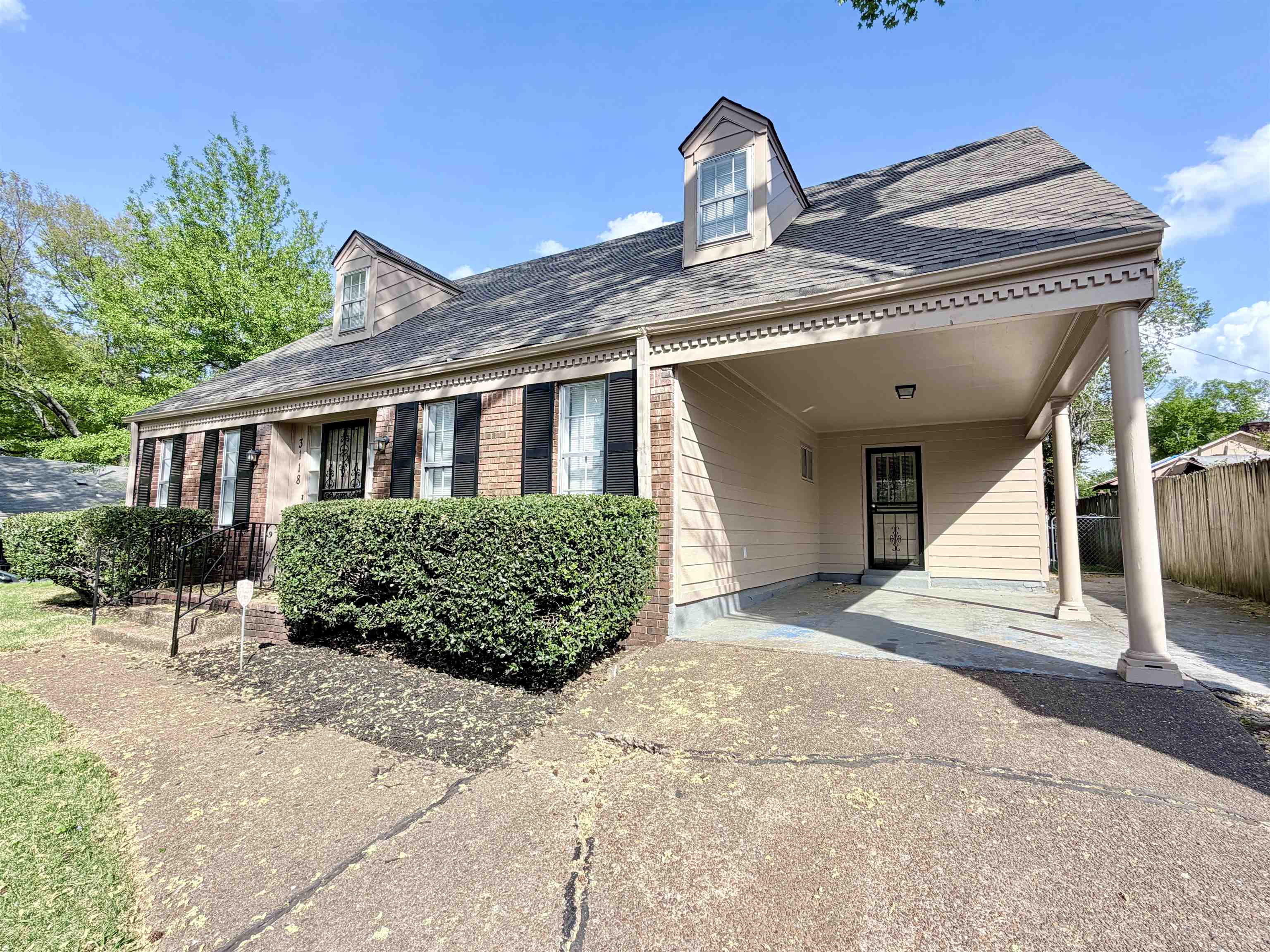 3118 Estes Street Memphis, TN 38115 - Photo 26 of 32 a front view of a house with a garden