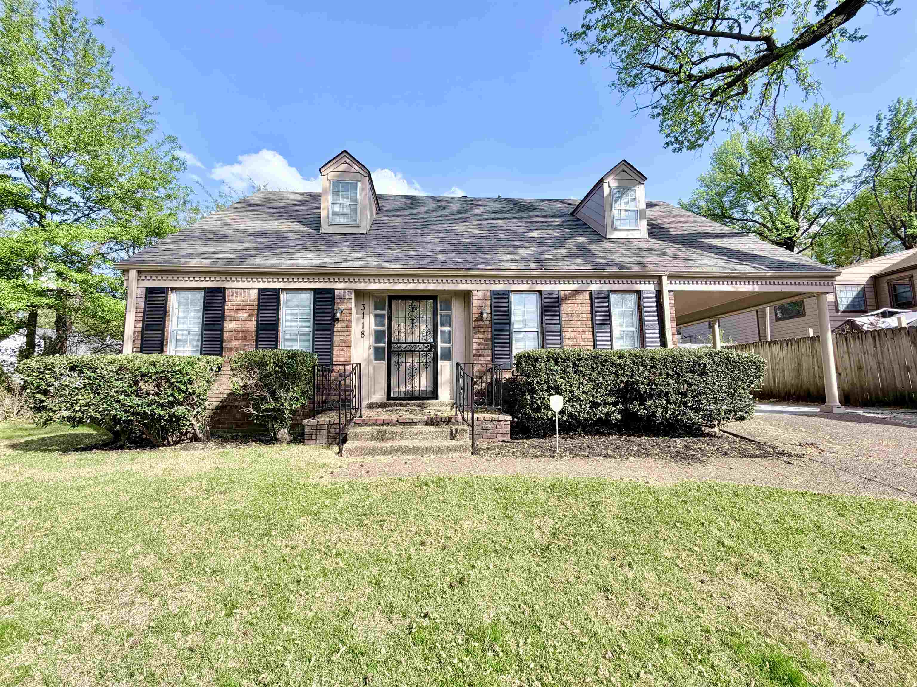 3118 Estes Street Memphis, TN 38115 - Photo 27 of 32 a front view of a house with garden