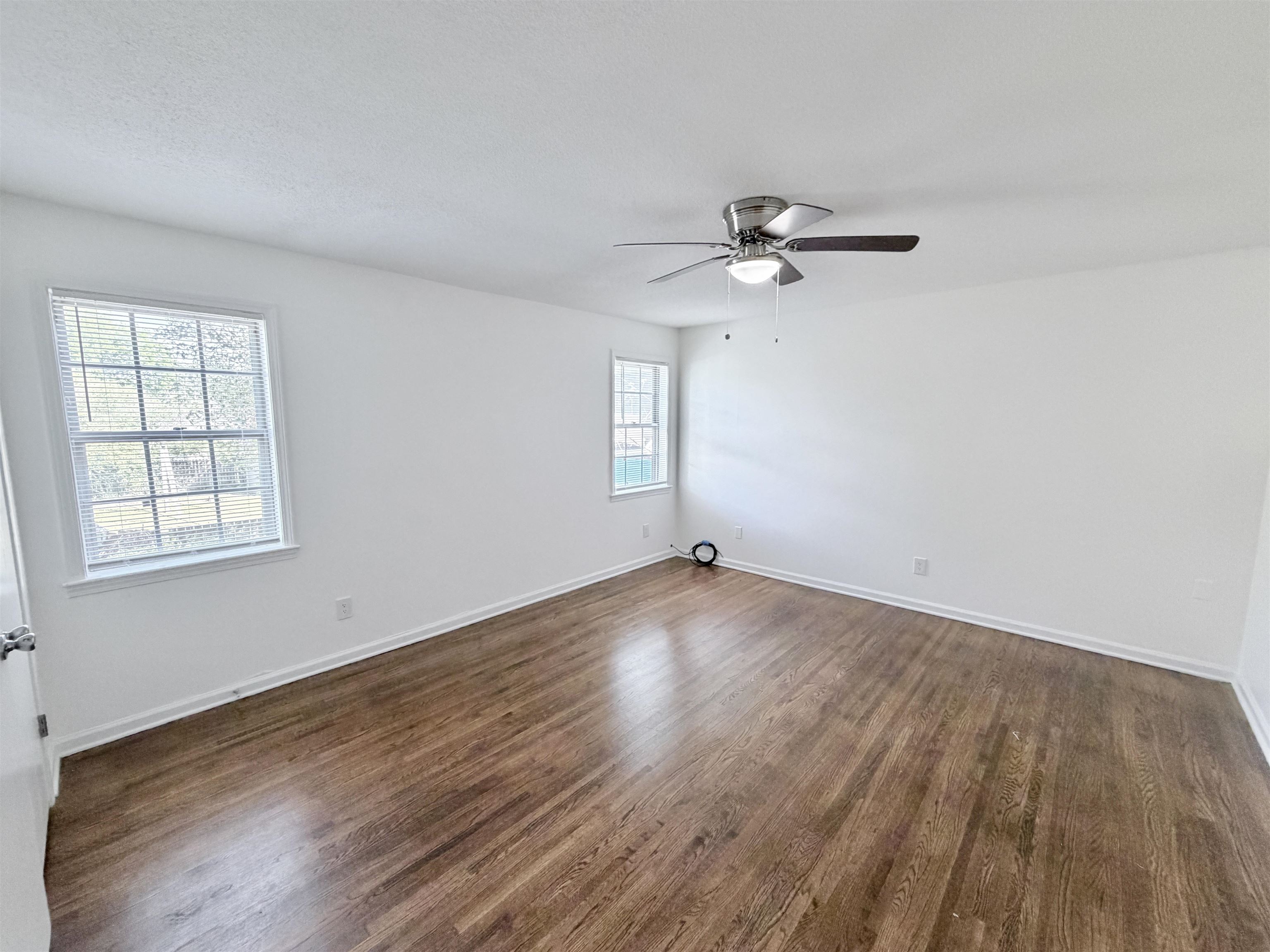 3118 Estes Street Memphis, TN 38115 - Photo 10 of 32 wooden floor in an empty room with a window