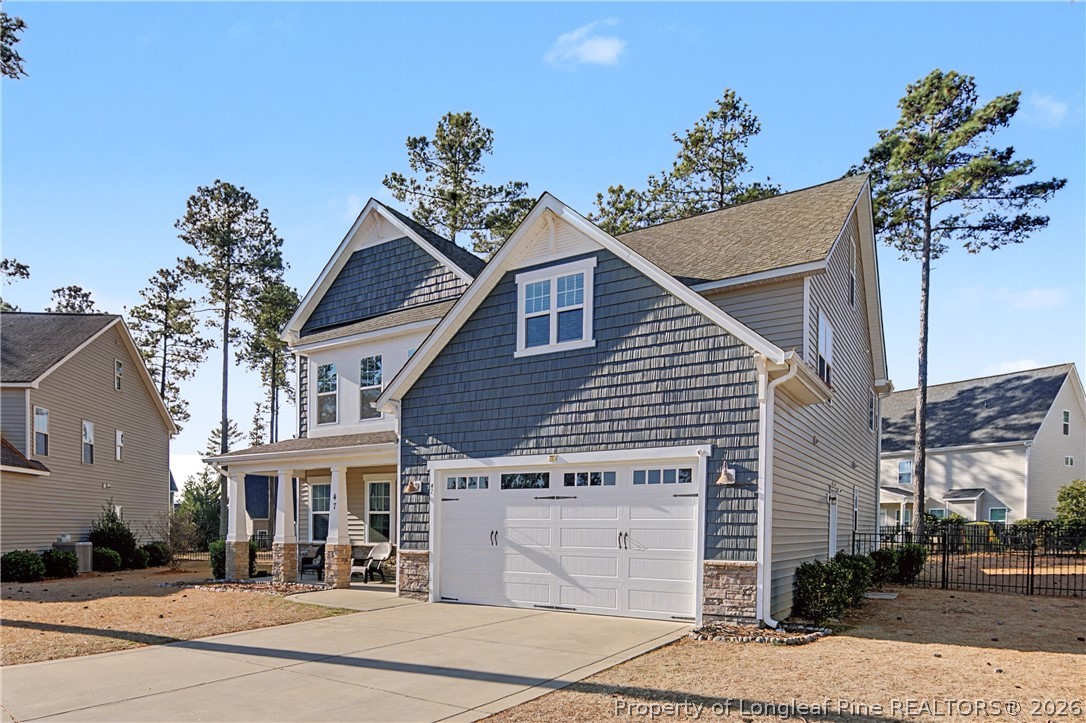 47 Pinnacle Drive Spring Lake, NC 28390 - Photo 3 of 50 a front view of a house with a garden