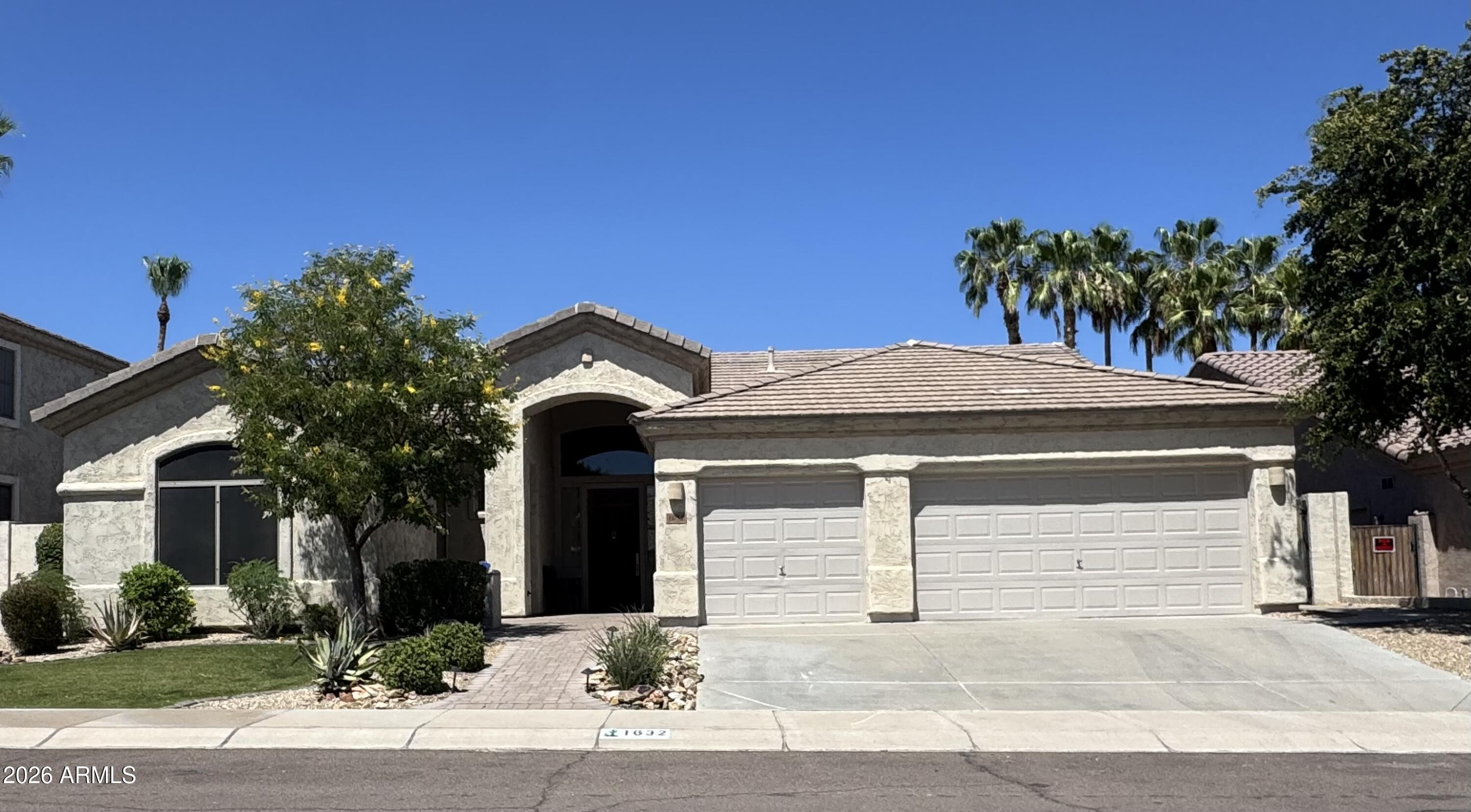 1632 West Frye Road Phoenix, AZ 85045 - Photo 37 of 37 a front view of a house with a garden