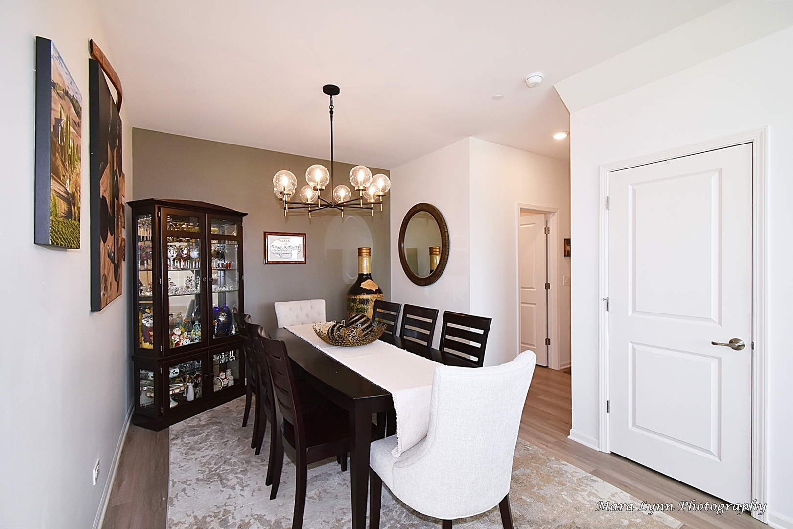 2085 Stuttle Road Batavia, IL 60510 - Photo 12 of 25 a dining room with furniture a chandelier and a rug