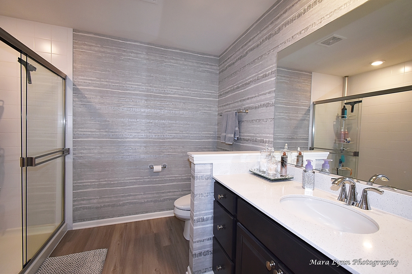 2085 Stuttle Road Batavia, IL 60510 - Photo 17 of 25 a bathroom with a sink a toilet a mirror and shower