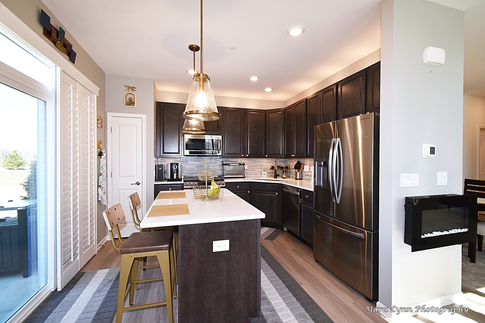 2085 Stuttle Road Batavia, IL 60510 - Photo 9 of 25 a kitchen with kitchen island a counter top space stainless steel appliances and cabinets