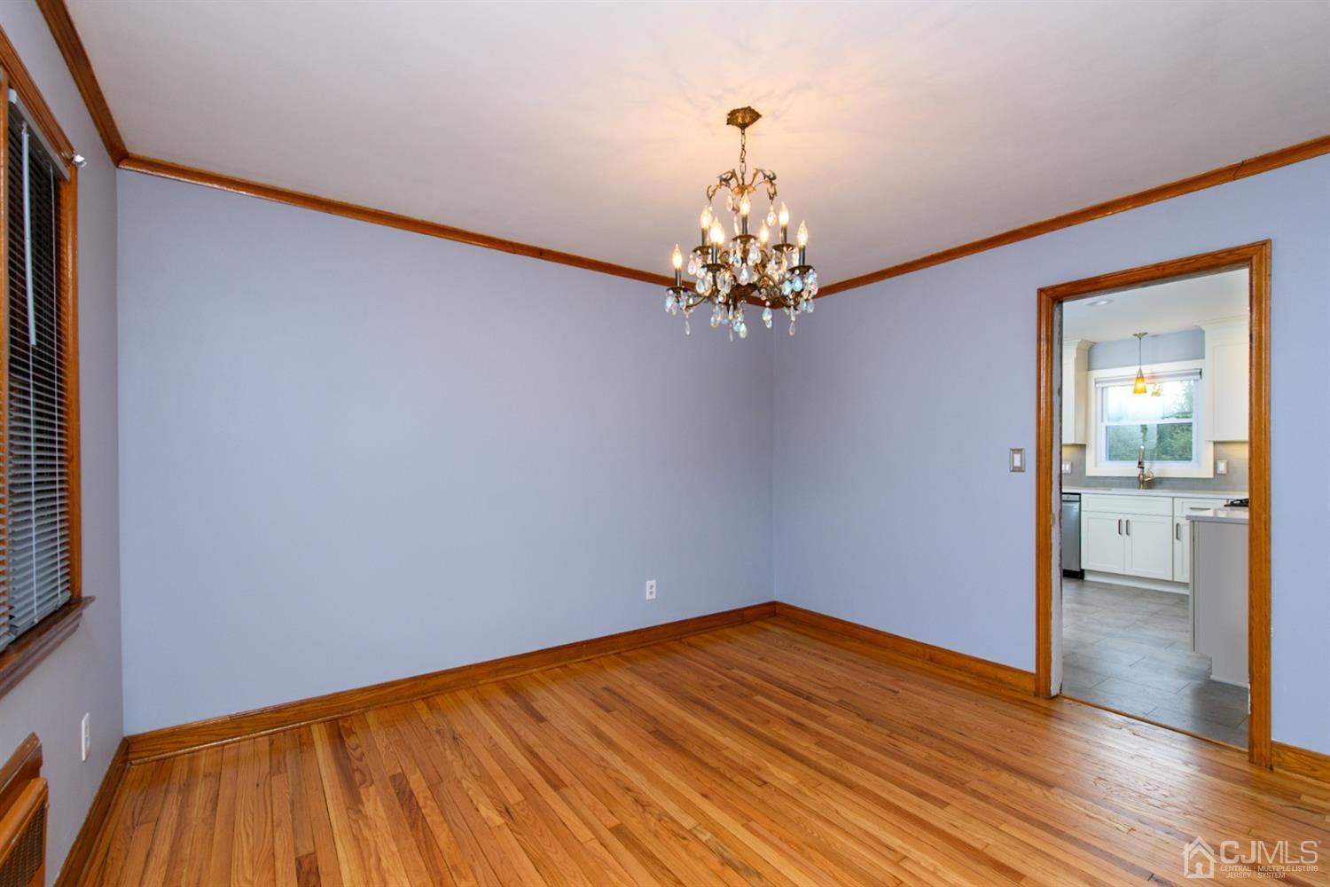 62 Middlesex Road Matawan, NJ 07747 - Photo 8 of 38 a view of empty room with wooden floor
