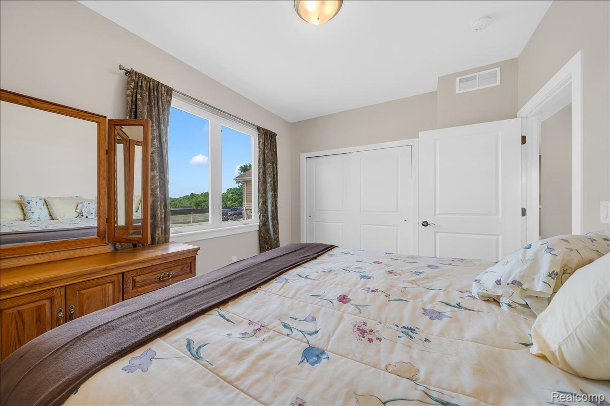 4266 McCandlish Road Grand Blanc, MI 48439 - Photo 33 of 68 Bright interior space featuring a large window, neutral wall paint, and white trim