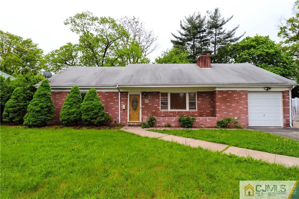 20 Old Post Road Edison, NJ 08817 - Photo 1 of 25 a front view of a house with a yard and green space