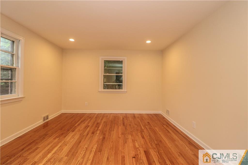 20 Old Post Road Edison, NJ 08817 - Photo 13 of 25 a view of a room with wooden floor and fan