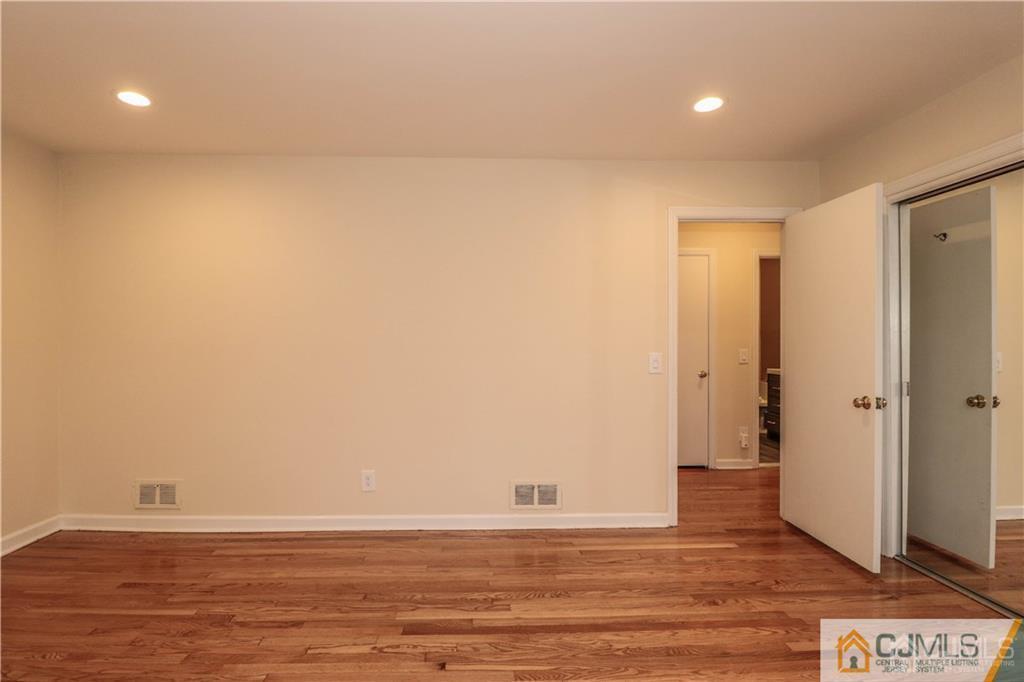 20 Old Post Road Edison, NJ 08817 - Photo 15 of 25 a view of an empty room with wooden floor