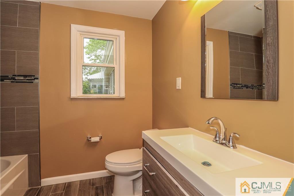 20 Old Post Road Edison, NJ 08817 - Photo 19 of 25 a bathroom with a sink and a toilet