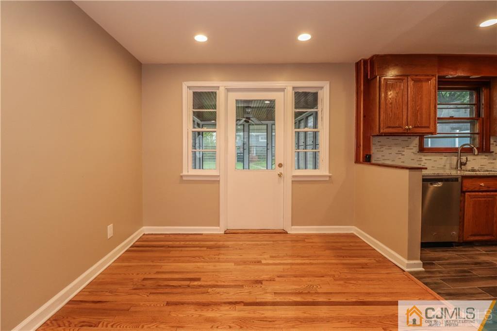 20 Old Post Road Edison, NJ 08817 - Photo 2 of 25 an empty room with wooden floor and windows